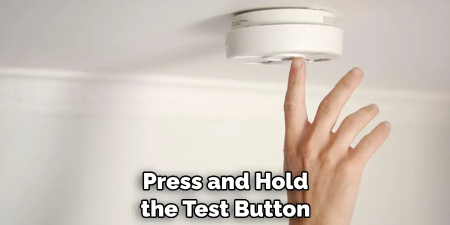 Press and Hold the Test Button