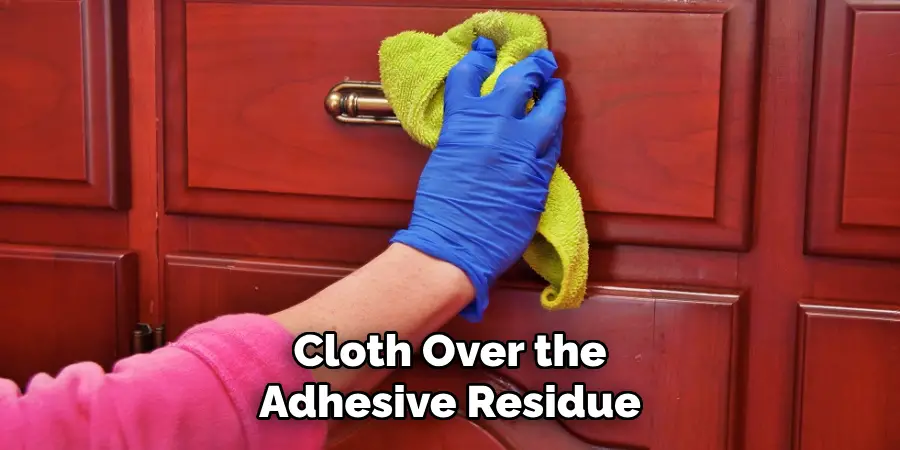 Cloth Over the
Adhesive Residue