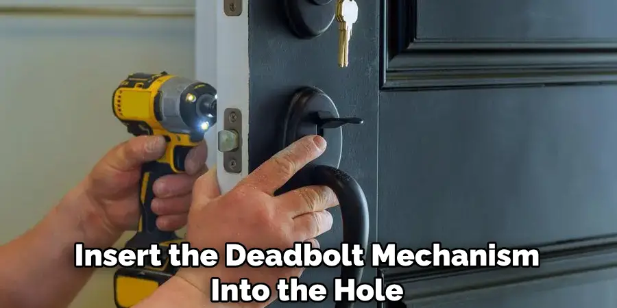 Insert the Deadbolt Mechanism Into the Hole