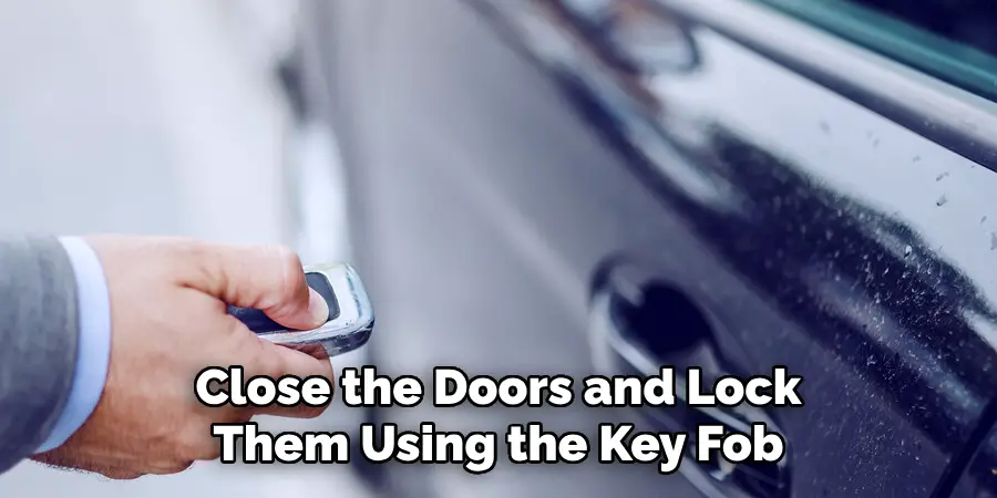 Close the Doors and Lock Them Using the Key Fob