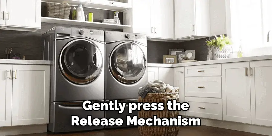 Gently press the Release Mechanism