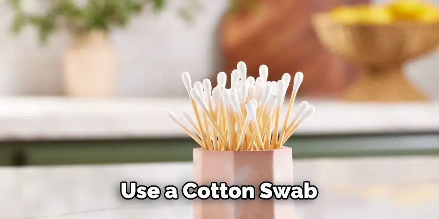 Use a Cotton Swab